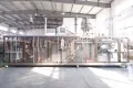 Горизонтальная фасовочно-упаковочная машина для пакетов дой-пак со штуцером с двумя дозирующими головками