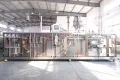 Сервоприводная машина для упаковки в пауч-пакеты с носиком из рулонной плёнки с двумя наполнительными головками